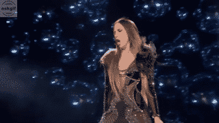 A naagin trying to scare off the people looking for naagmani.